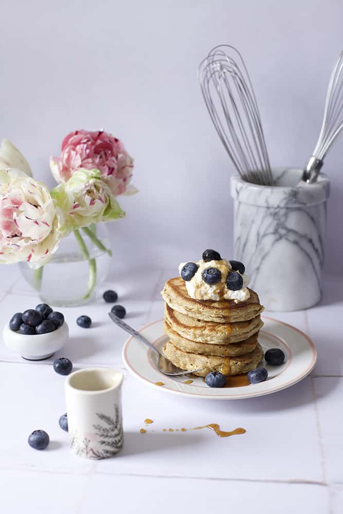 oat flour pancakes with blueberries and maple syrup